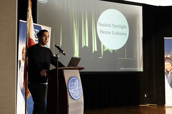 Student Trustee Hector Ledesma presenting