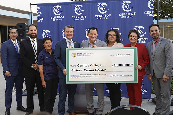 College officials and speaker rendon with a large check