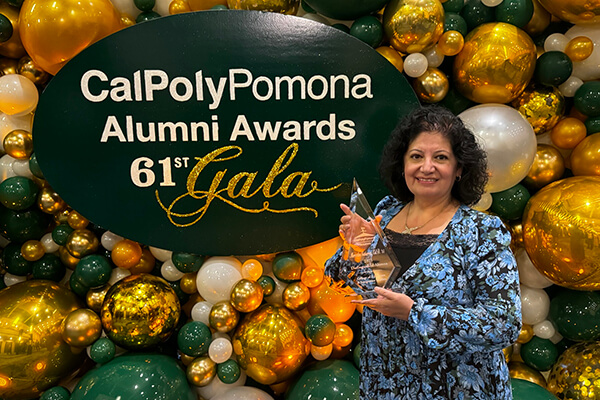 Dr. Mercedes Gutierrez with the award