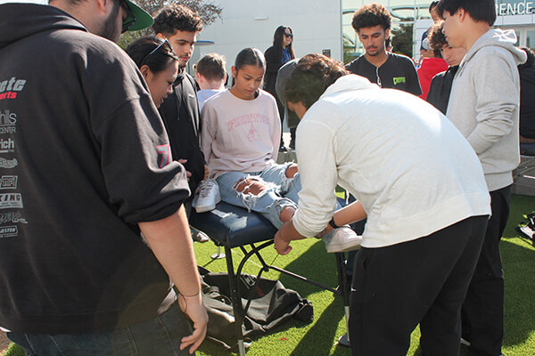 Students working on taping techniques