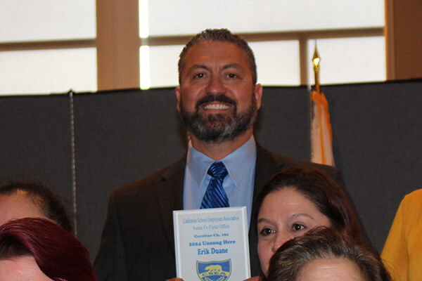 Erik Duane with the award