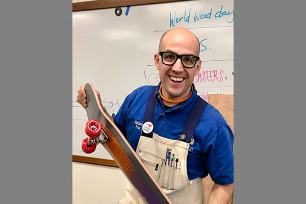 Reuben Foat holding a skateboard