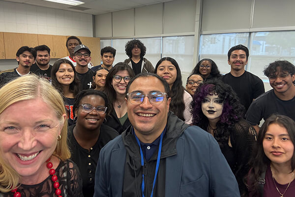 Kimberley Duff, Ron Macias, and students in a classroom