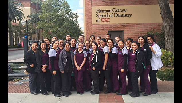 Group of Dental Students in front of a USC building