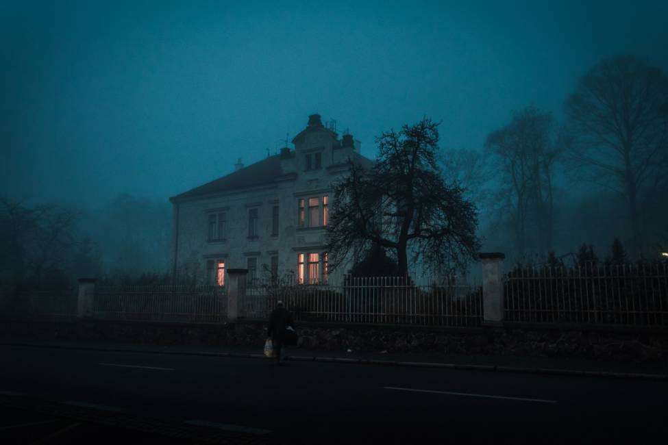 Old creepy mansion in fog