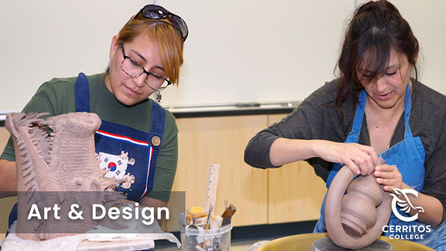 Two students working on ceramic clay