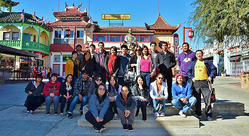 Students gathered in front of a Chinese building