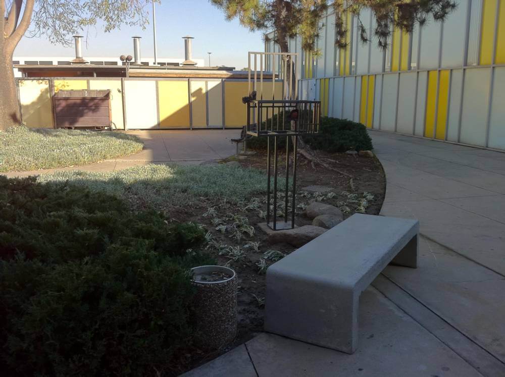 Metal Sculpture in Outdoor. Courtyard with Modern Building