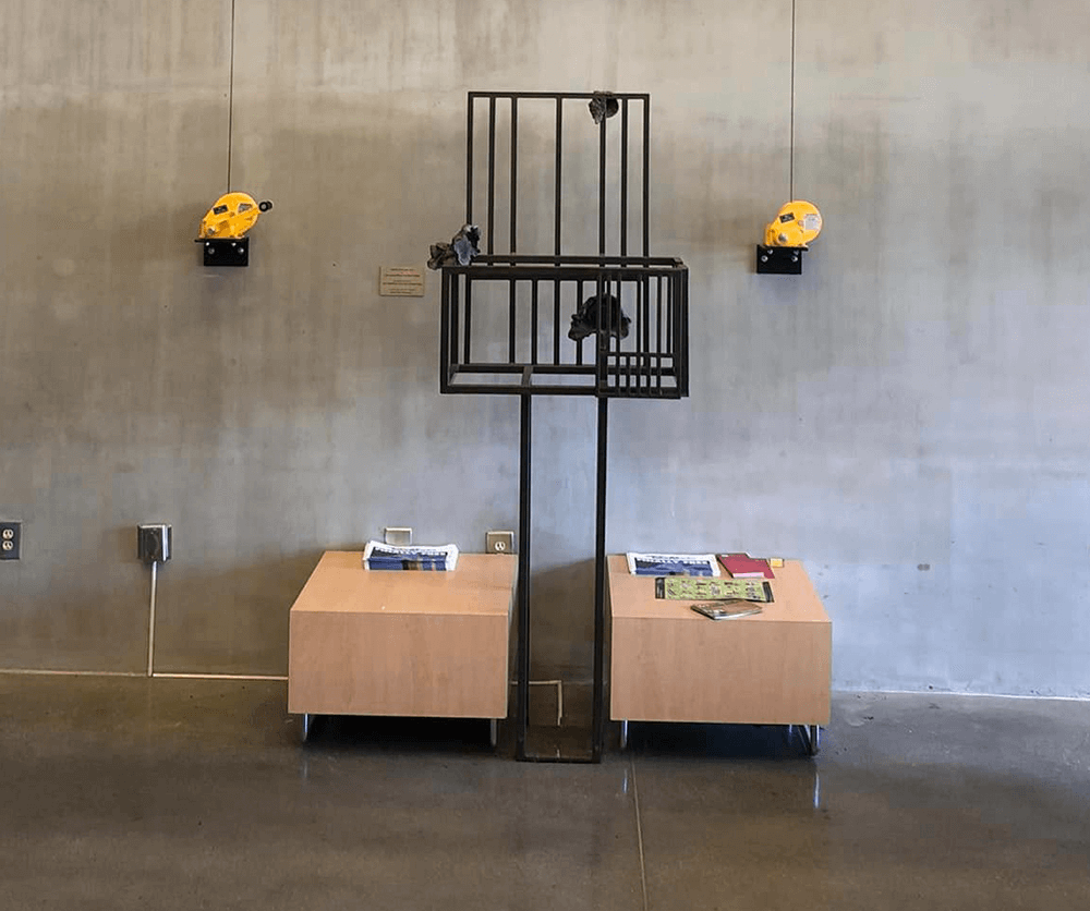 Metal Sculpture in Concrete Foyer