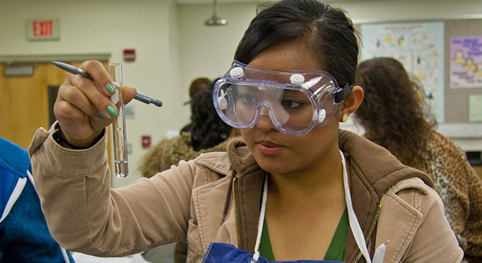 Student in science class holding a test tube