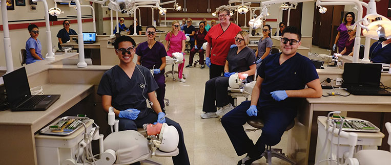 Dental Hygiene Instructor and a class of students