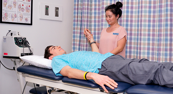 Nursing student taking a student's blood pressure