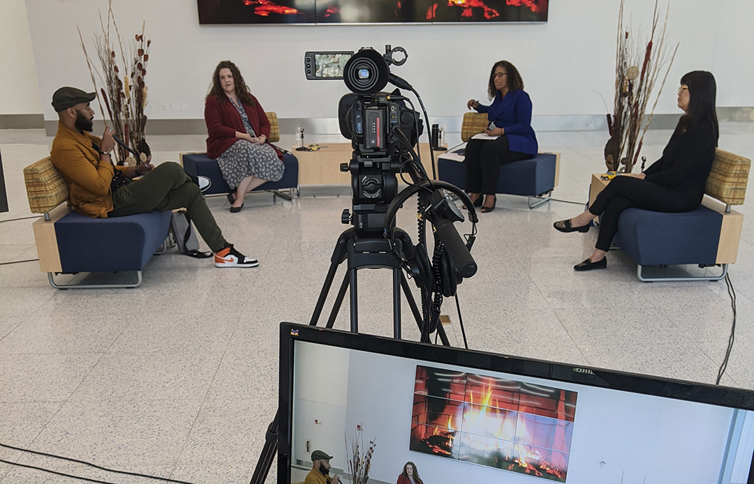 group chat being videotaped live in conference center