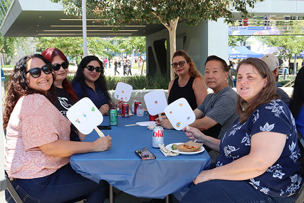 Employees enjoying BBQ