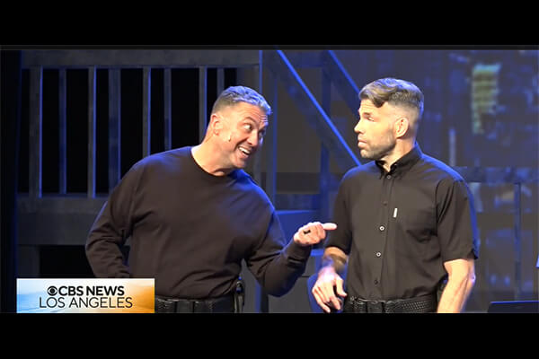 Erik Duane and another actor on stage