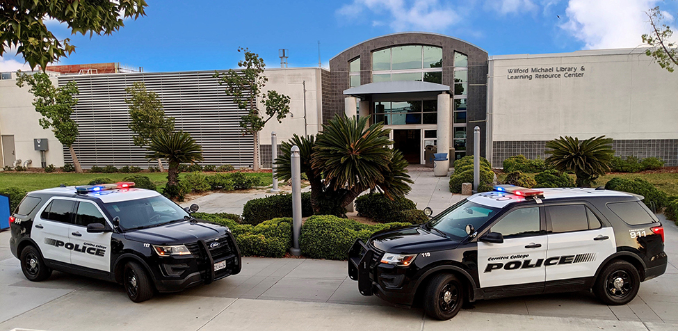 Two Campus Police Vehicle Units parked in front of the Learning Resource Center