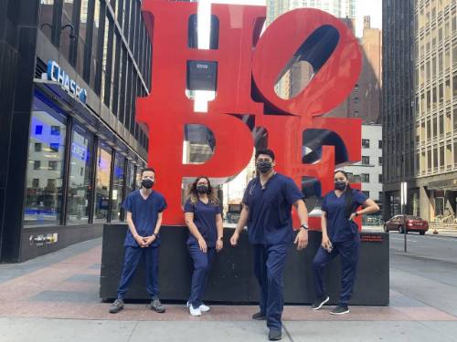 Nursing Students in New York City standing in font of a HOPE sign