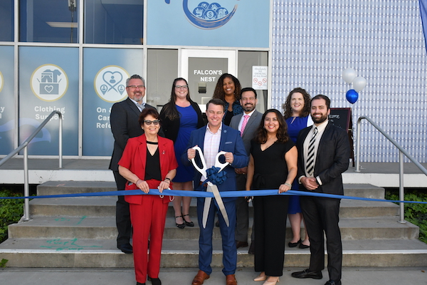 College officials cutting ribbon for the Falcon's Nest