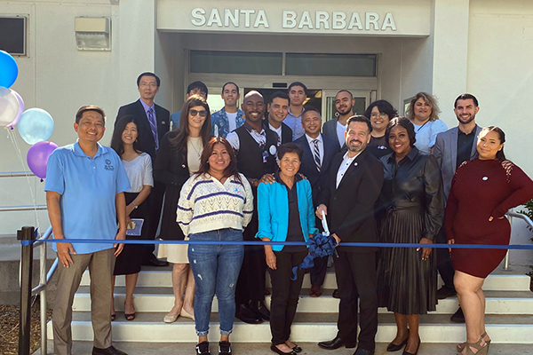 College officials and students cutting ribbon