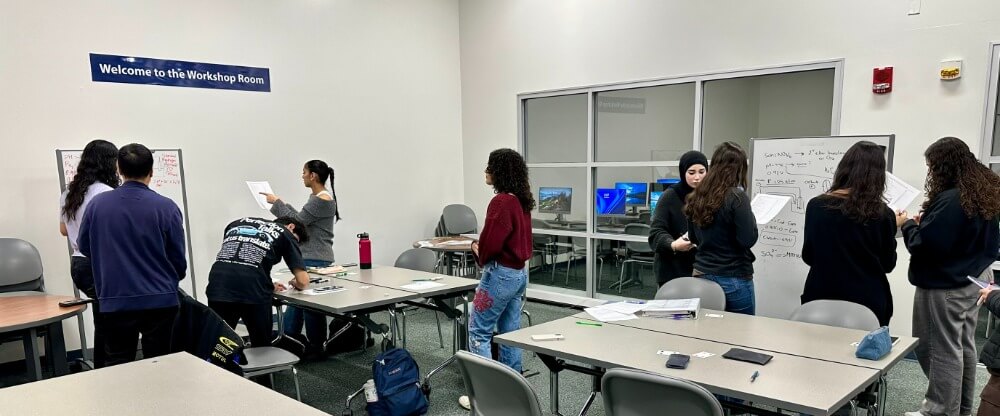 Students in an academic excellence workshop. Students working collaboratively during an academic excellence workshop.